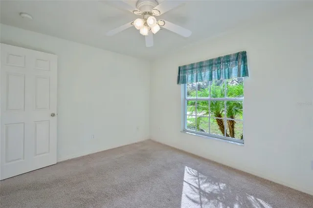 a aerial view of a house with yard and green space