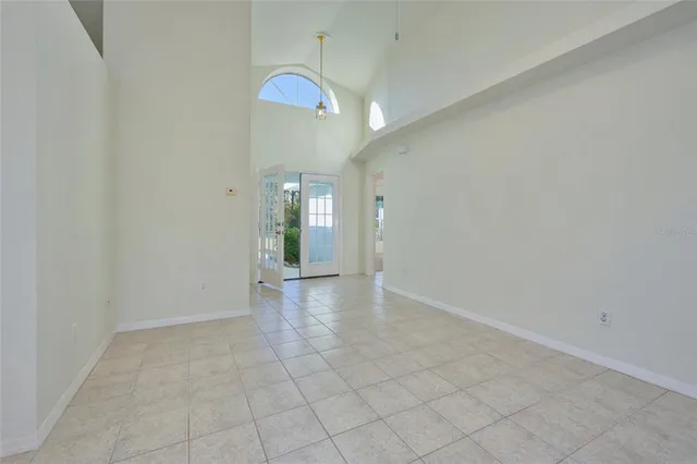 a view of a kitchen with a sink and a refrigerator