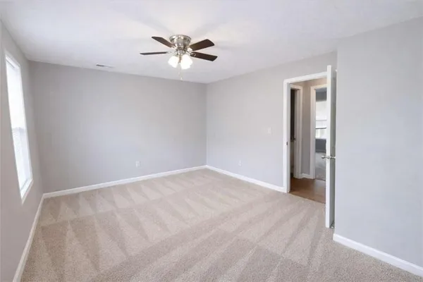 a view of an empty room with a window