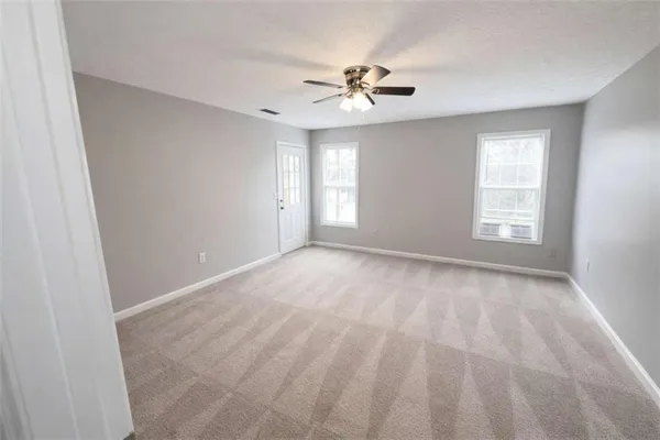 a view of an empty room with a window