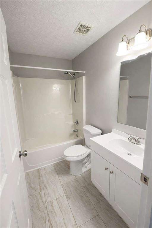 118 Chippewa Run Auburn, GA 30011 - Photo 21 of 26 a bathroom with a sink a toilet and shower