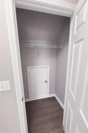 a view of an empty walk in closet