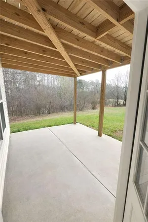a view of balcony with wooden floor and fence