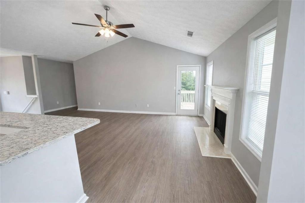 118 Chippewa Run Auburn, GA 30011 - Photo 6 of 26 wooden floor in an empty room with a window