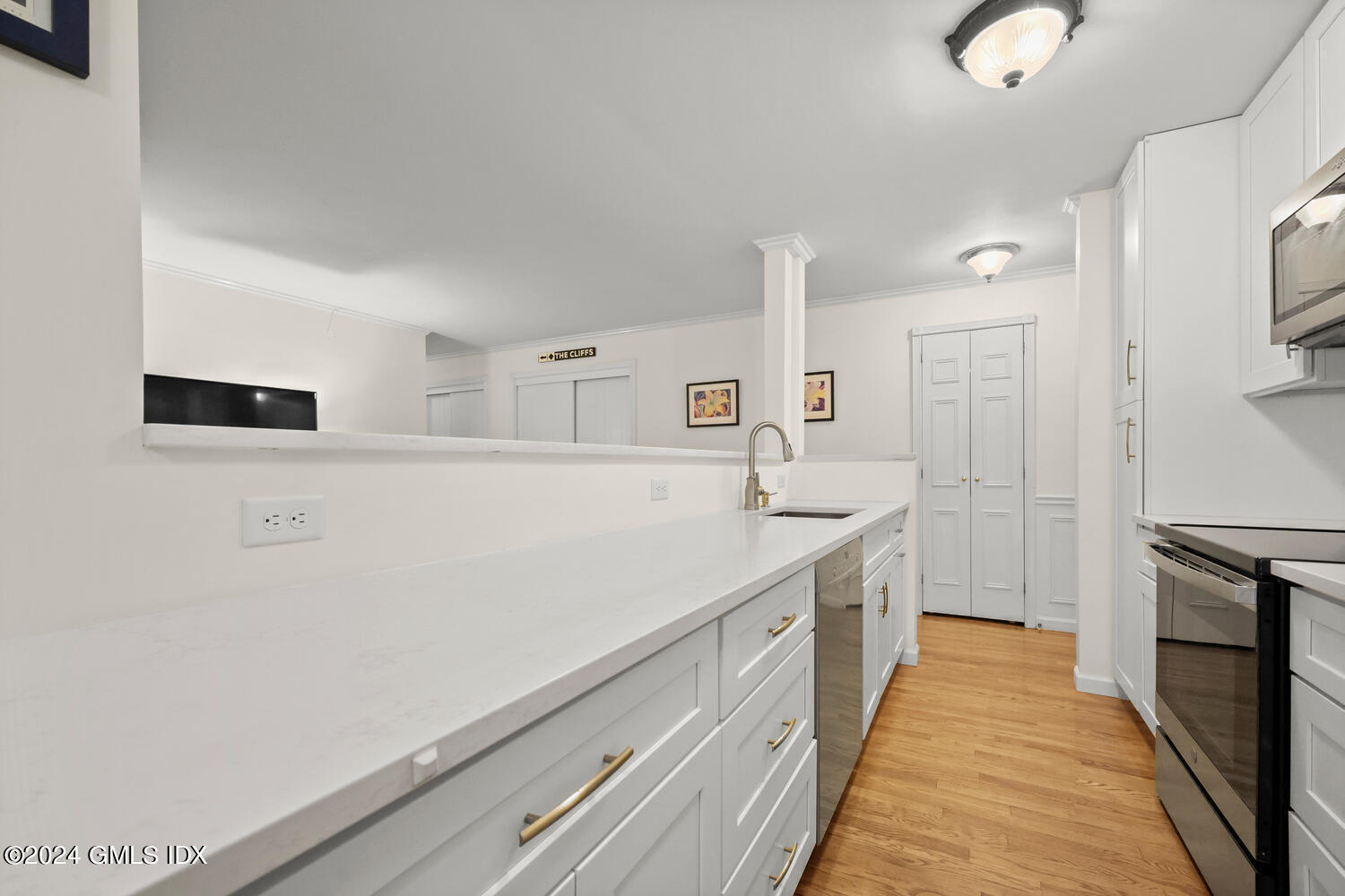 76 Maple Tree Avenue, Unit 3 Stamford, CT 06906 - Photo 12 of 33 a kitchen with granite countertop a sink and a stove