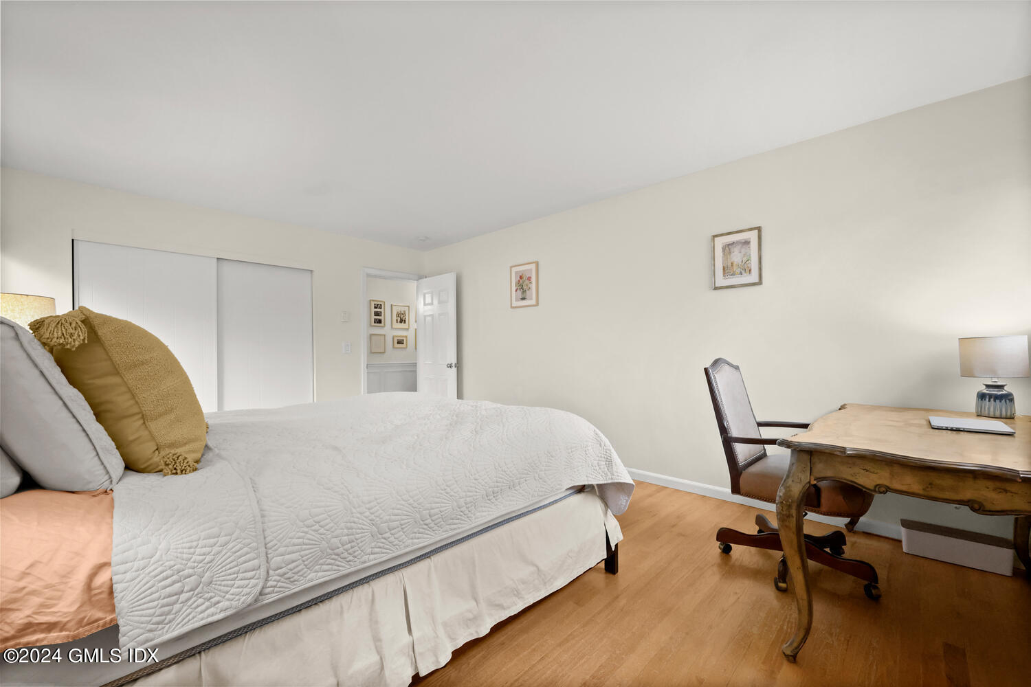 76 Maple Tree Avenue, Unit 3 Stamford, CT 06906 - Photo 16 of 33 a bedroom with a bed and a desk