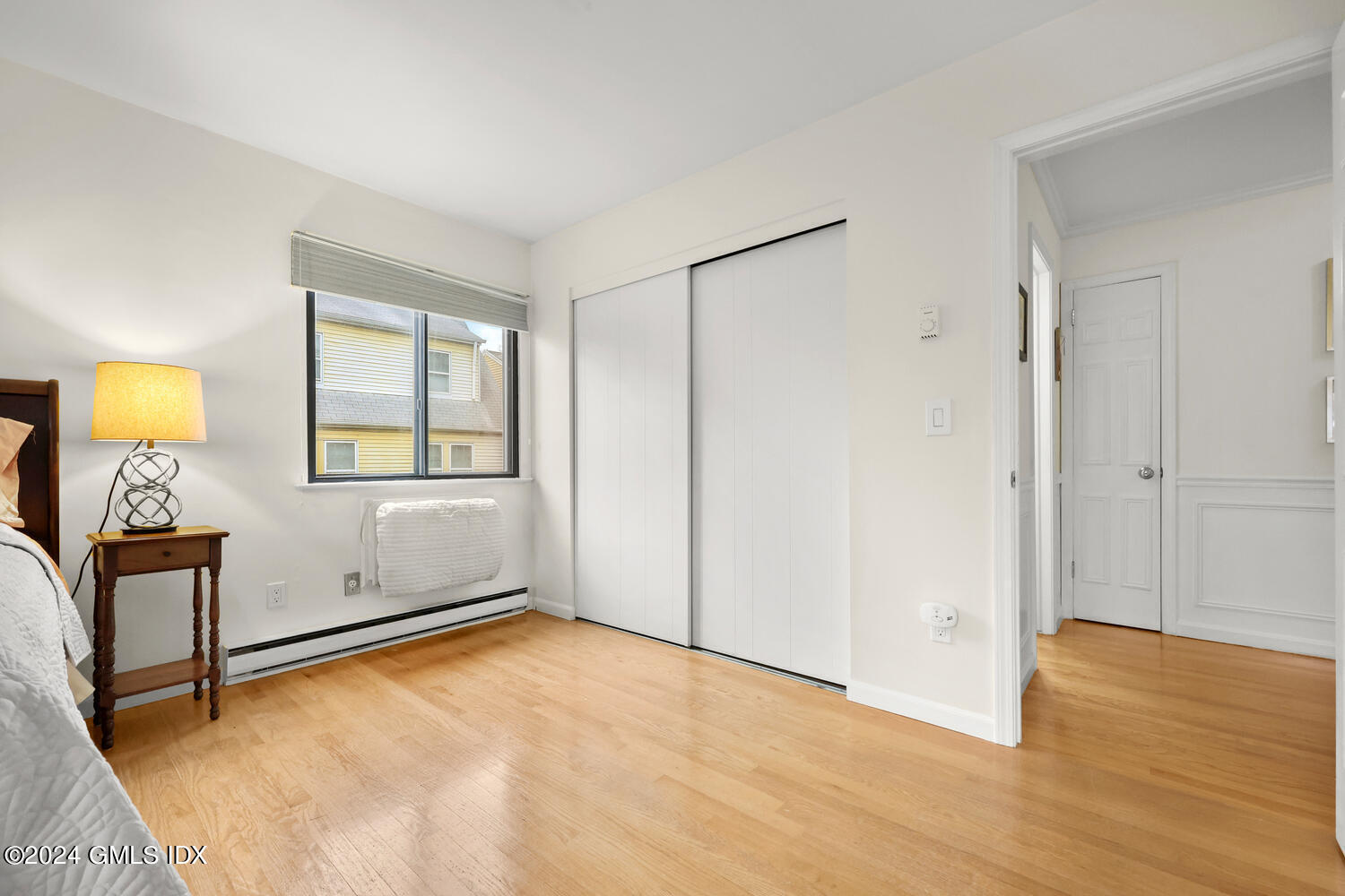 76 Maple Tree Avenue, Unit 3 Stamford, CT 06906 - Photo 17 of 33 a view of empty room with wooden floor and fan