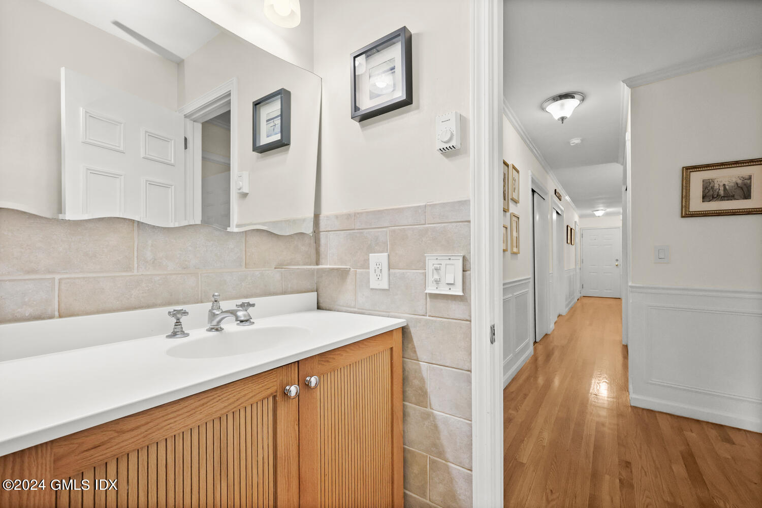 76 Maple Tree Avenue, Unit 3 Stamford, CT 06906 - Photo 20 of 33 a bathroom with a sink and a mirror