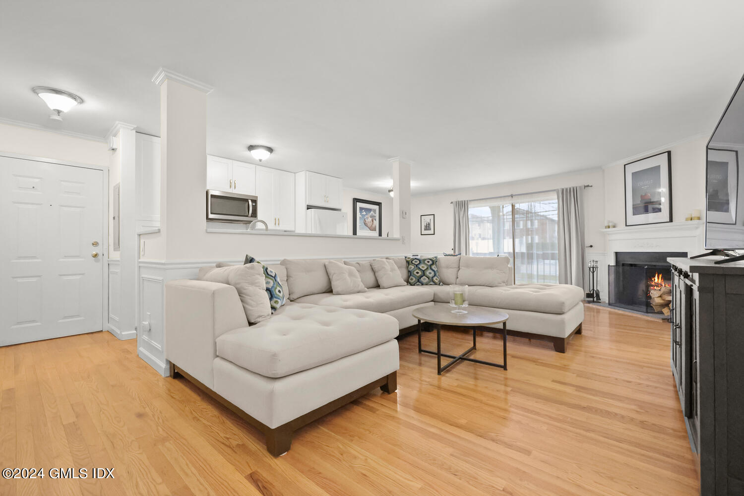 76 Maple Tree Avenue, Unit 3 Stamford, CT 06906 - Photo 2 of 33 a living room with furniture and a wooden floor