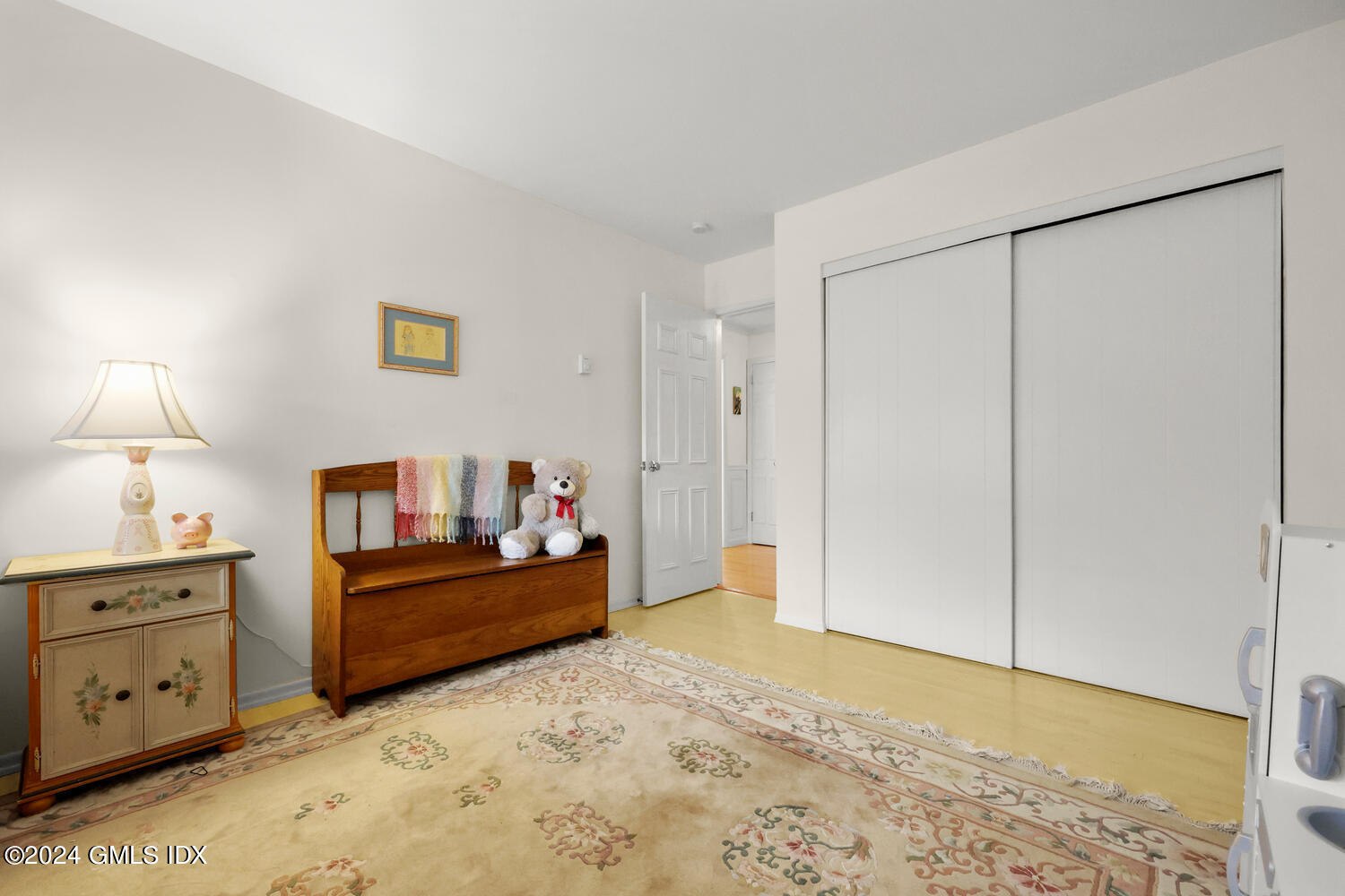 76 Maple Tree Avenue, Unit 3 Stamford, CT 06906 - Photo 22 of 33 a bedroom with a bed and a lamp on dresser