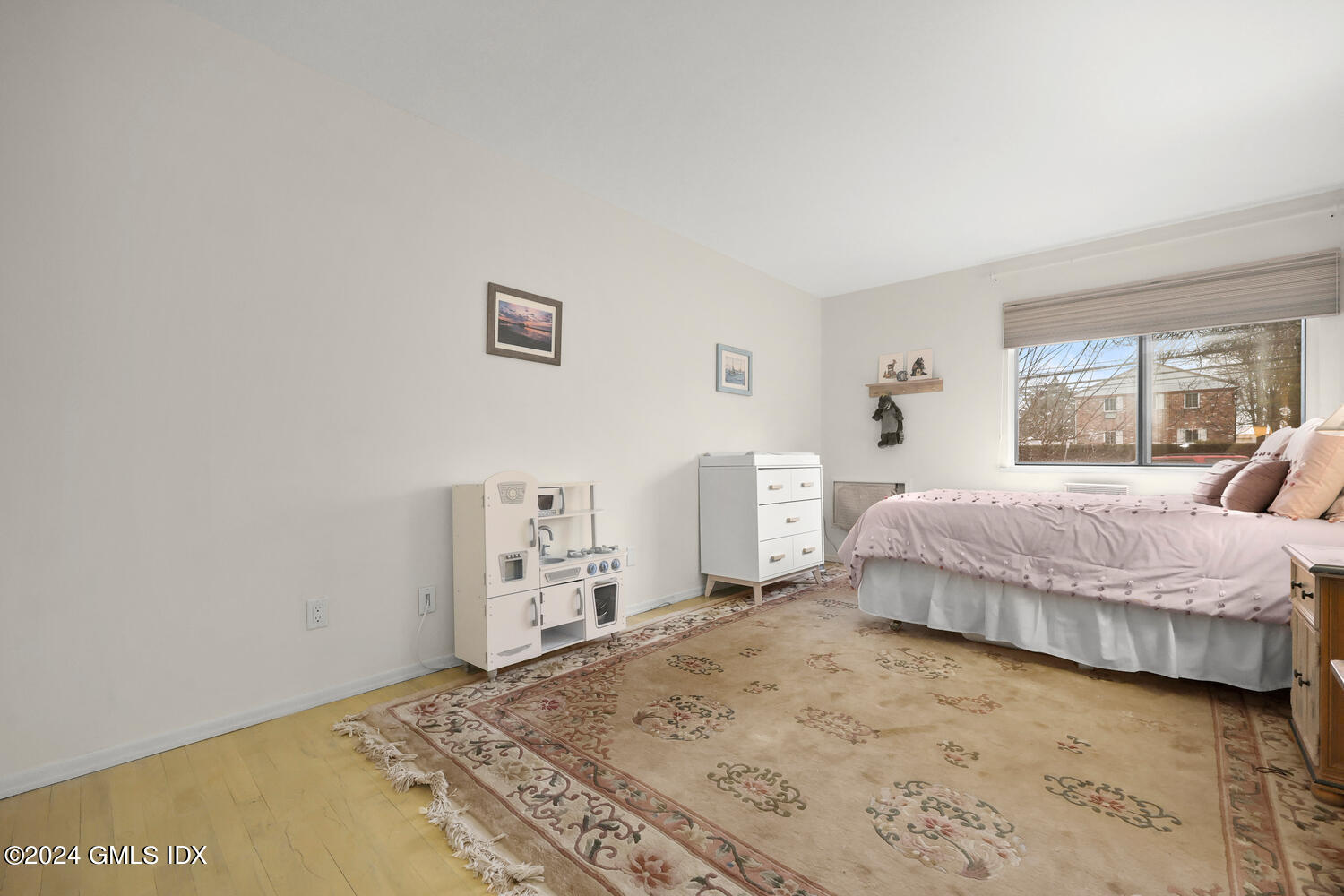 76 Maple Tree Avenue, Unit 3 Stamford, CT 06906 - Photo 24 of 33 a bedroom with a bed and a large window