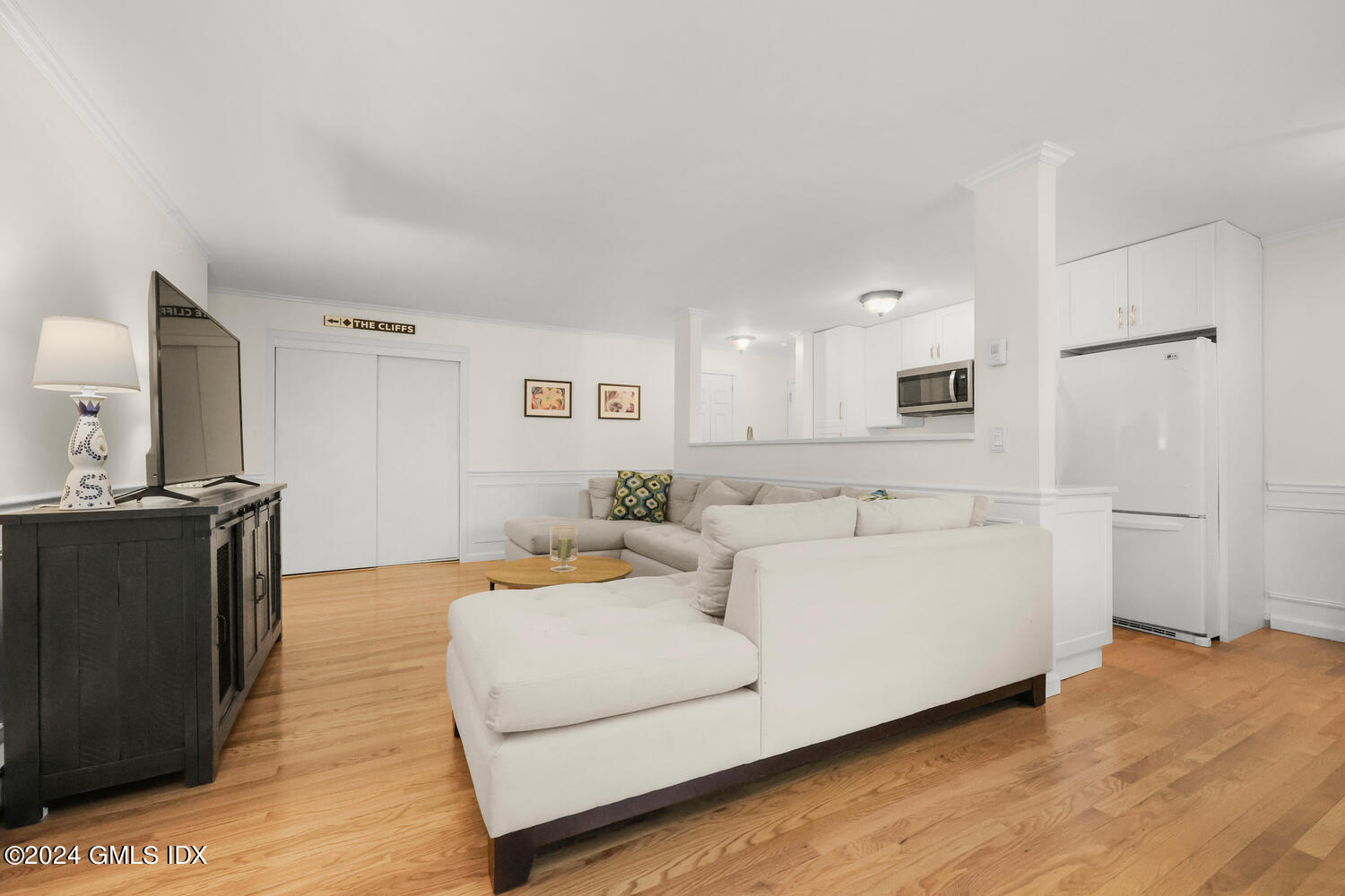 76 Maple Tree Avenue, Unit 3 Stamford, CT 06906 - Photo 3 of 33 a living room with furniture and a wooden floor