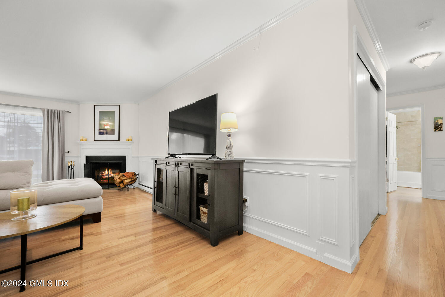 76 Maple Tree Avenue, Unit 3 Stamford, CT 06906 - Photo 7 of 33 a living room with furniture and a flat screen tv