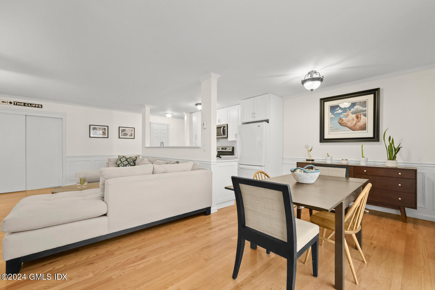 76 Maple Tree Avenue, Unit 3 Stamford, CT 06906 - Photo 8 of 33 a view of a dining room with furniture and wooden floor