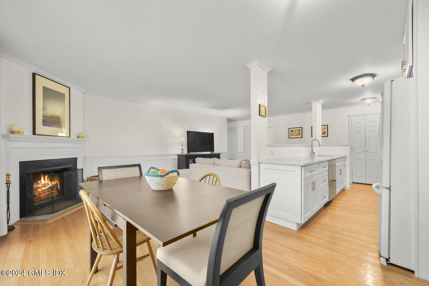 76 Maple Tree Avenue, Unit 3 Stamford, CT 06906 - Photo 10 of 33 a view of a dining room with furniture and a fireplace