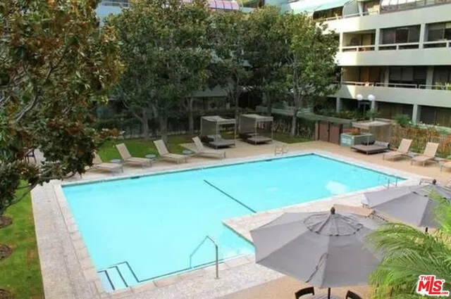 a view of a swimming pool with a patio
