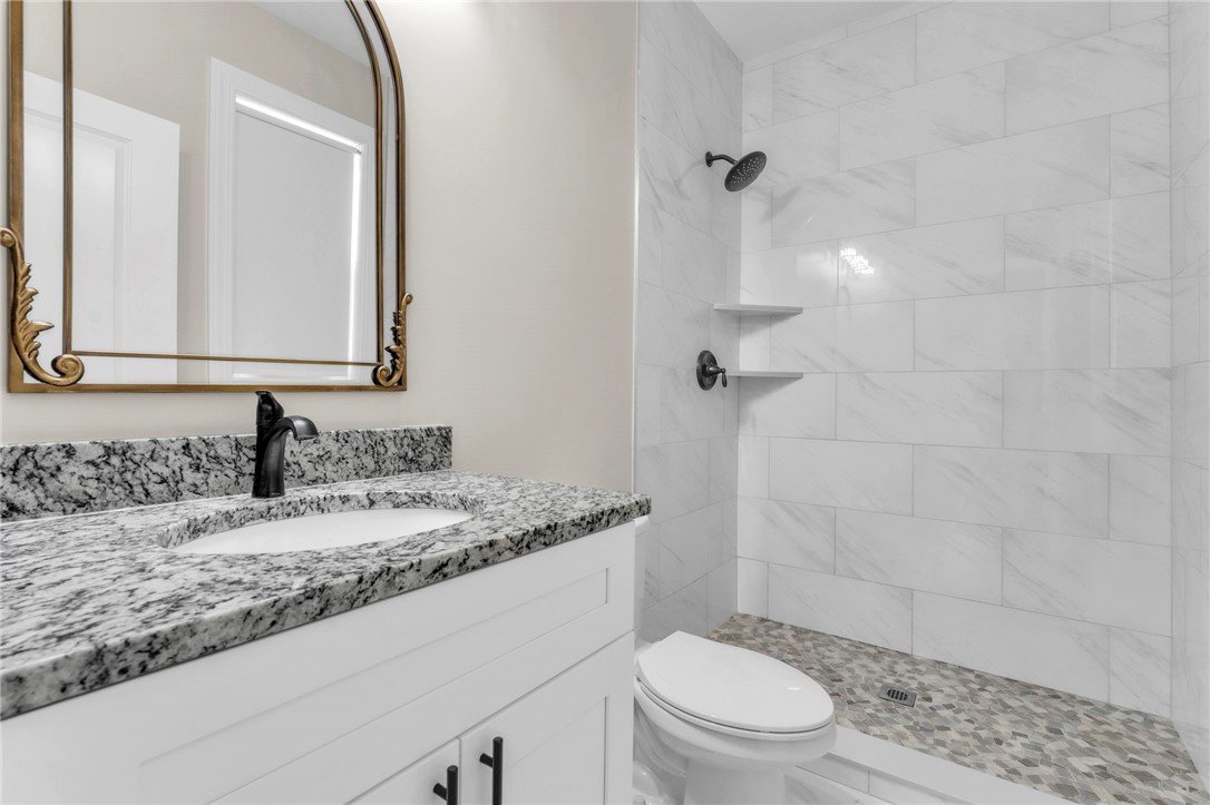 1015 Winmar Drive Anderson, SC 29621 - Photo 32 of 49 This bright bathroom features a modern vanity with elegant granite counters and a spacious shower.