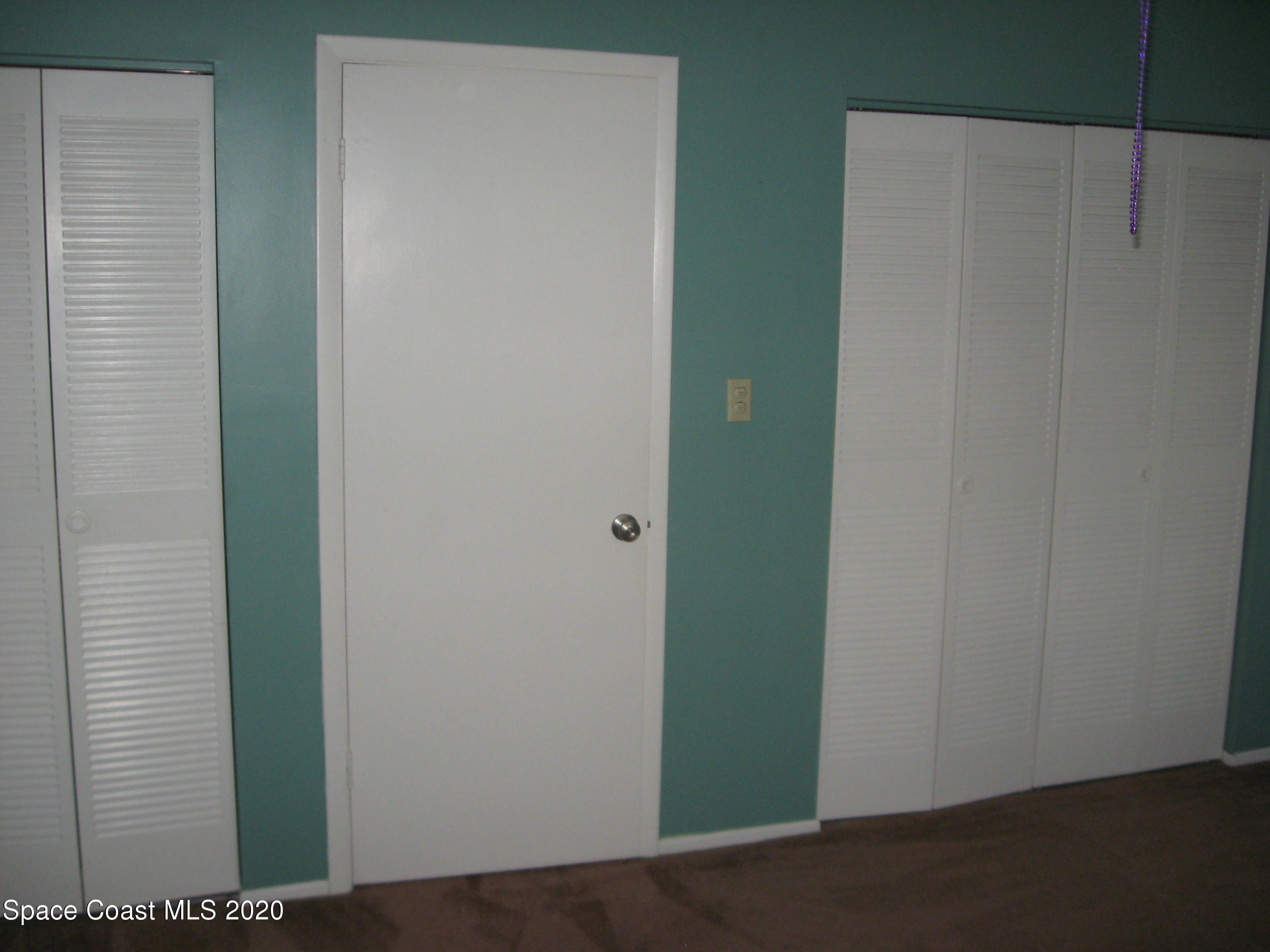 4795 Sisson Road Titusville, FL 32780 - Photo 14 of 27 2 Sets of Closets in Master Bedroom
