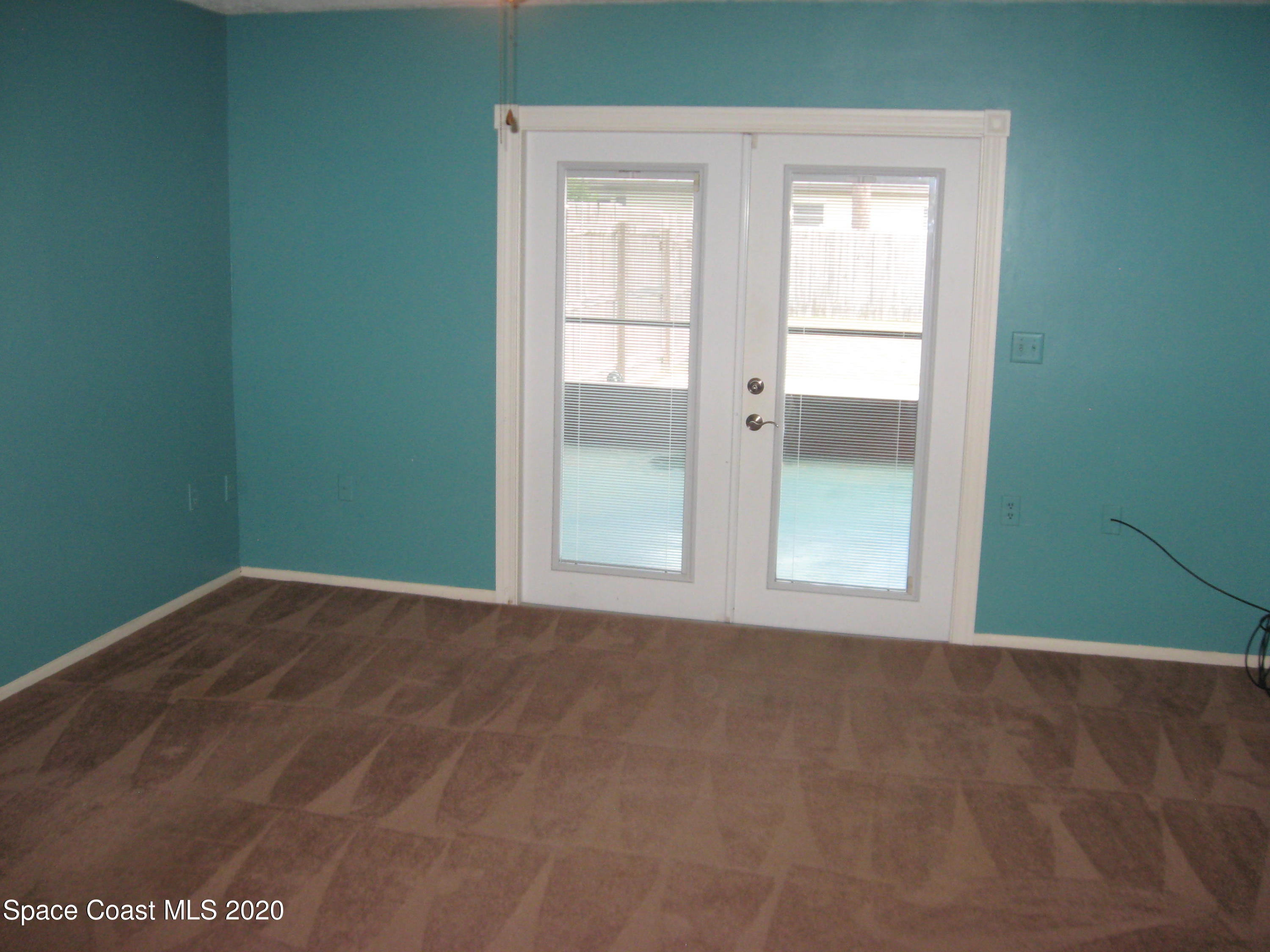 4795 Sisson Road Titusville, FL 32780 - Photo 4 of 27 Living Room to Porch
