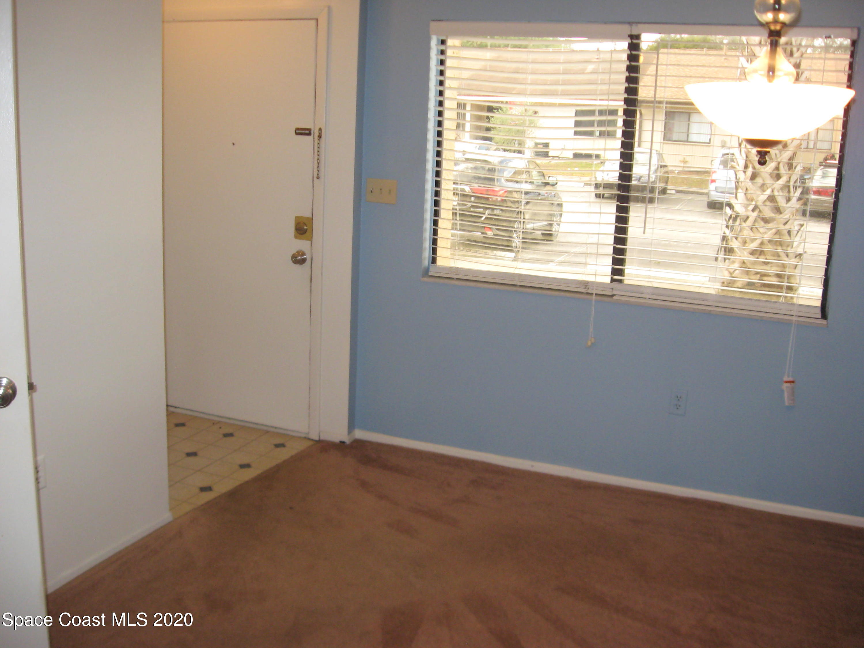 4795 Sisson Road Titusville, FL 32780 - Photo 7 of 27 Dining Room and Front Entrance