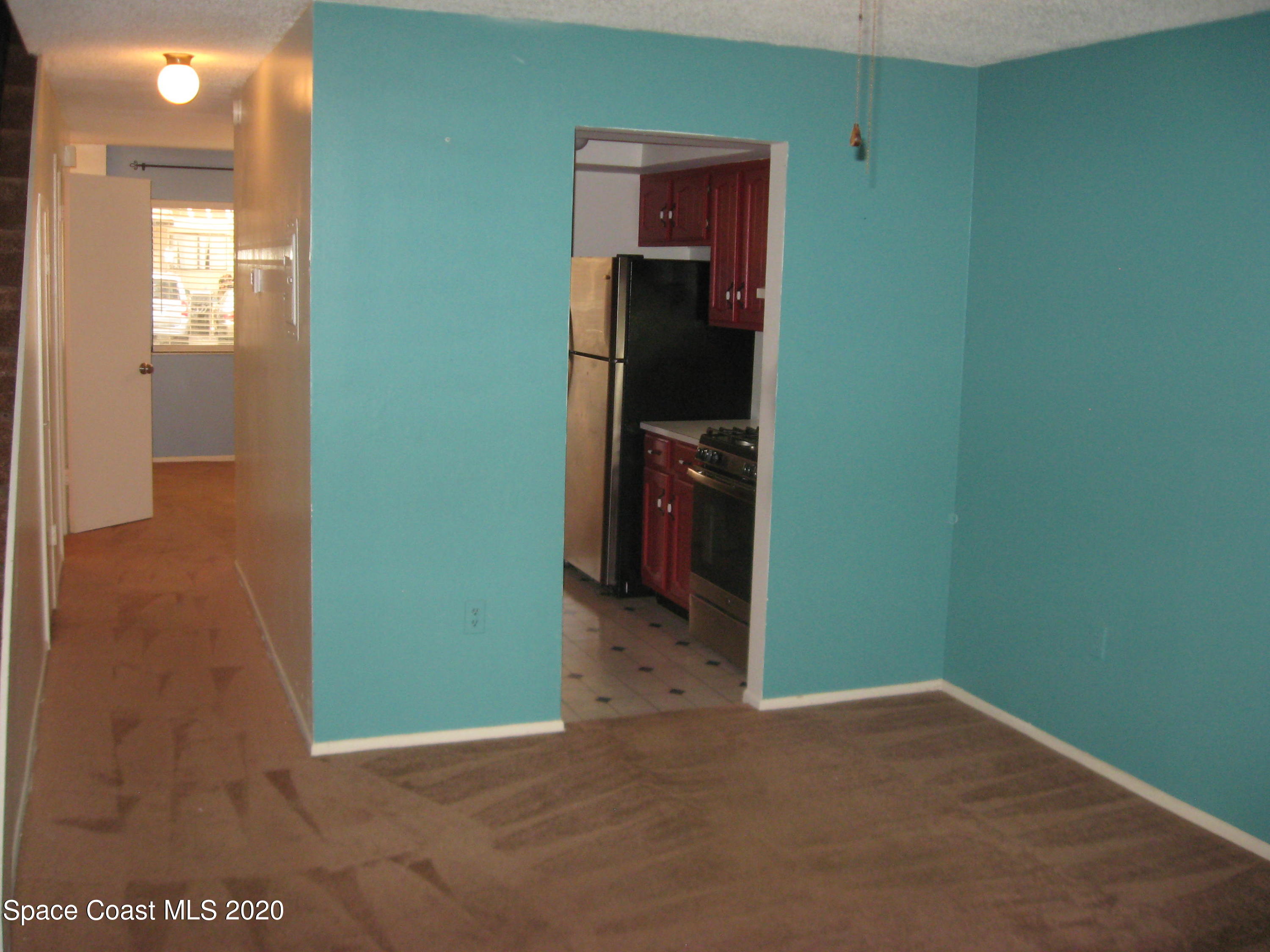 4795 Sisson Road Titusville, FL 32780 - Photo 8 of 27 Living Room to Kitchen