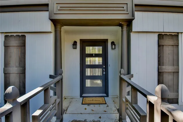 a view of an entryway with wooden floor