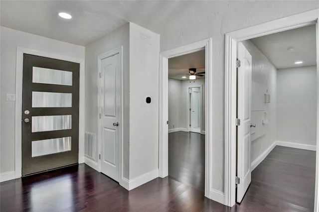 wooden floor with white walls