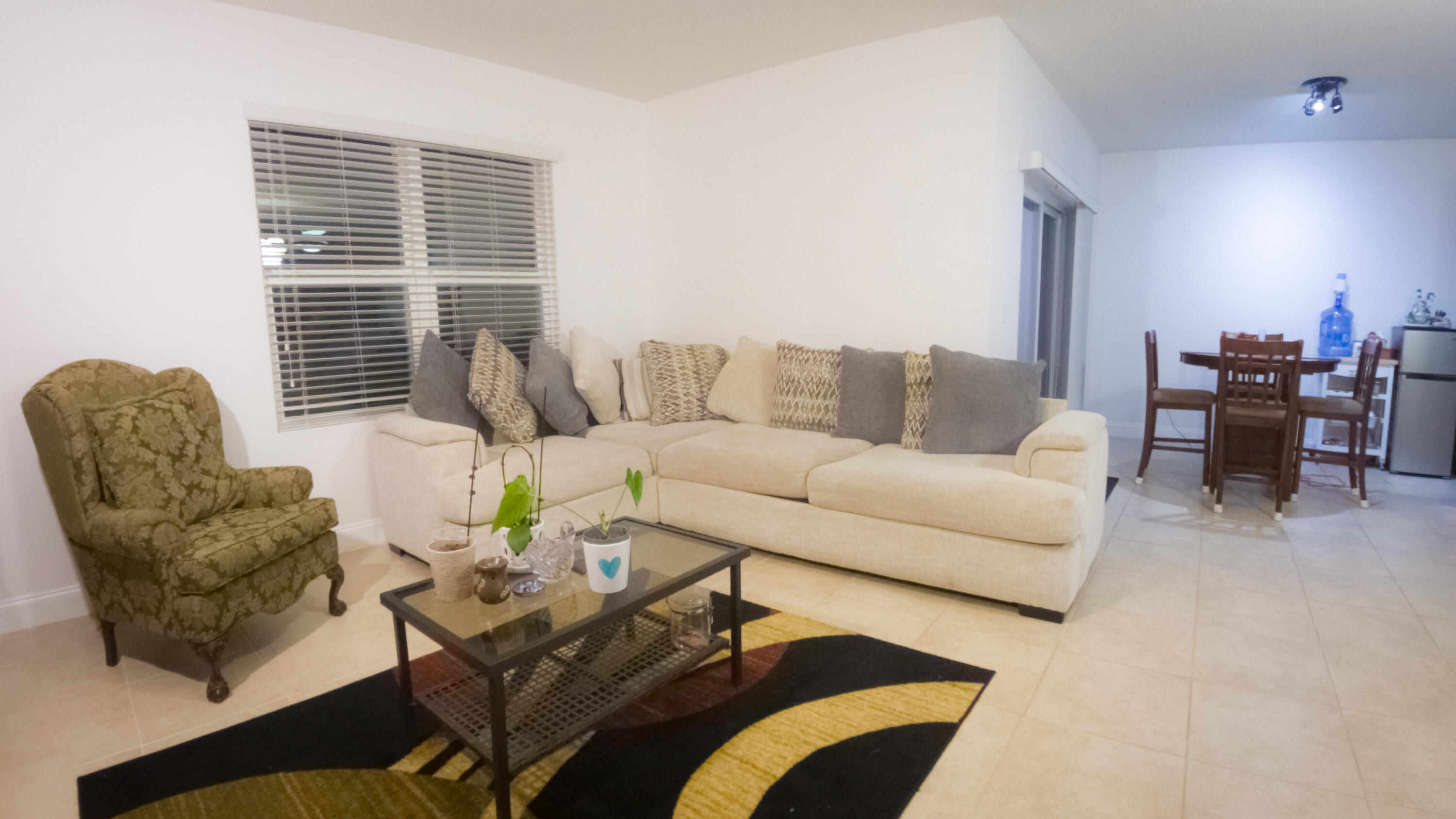 1162 Southwest Coleman Avenue Port St. Lucie, FL 34953 - Photo 18 of 27 a living room with furniture and a large window