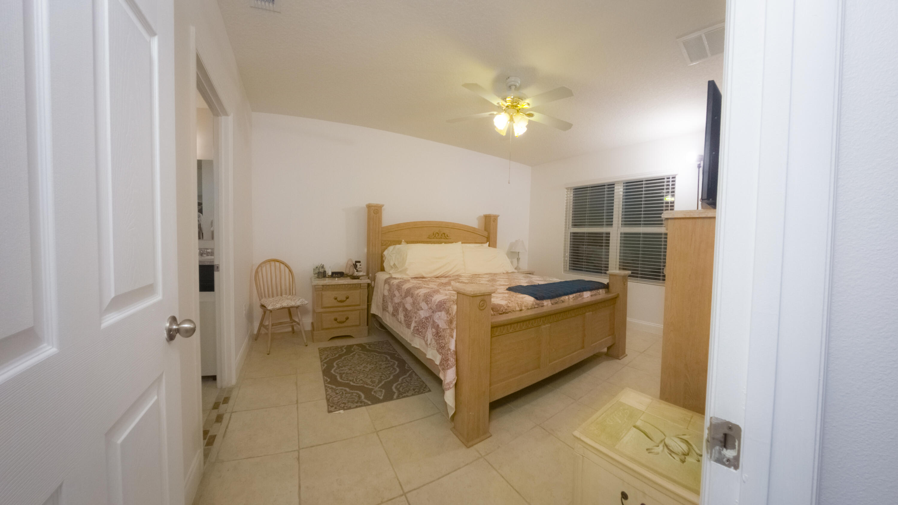 1162 Southwest Coleman Avenue Port St. Lucie, FL 34953 - Photo 19 of 27 a bathroom with a sink a light fixture and a shower