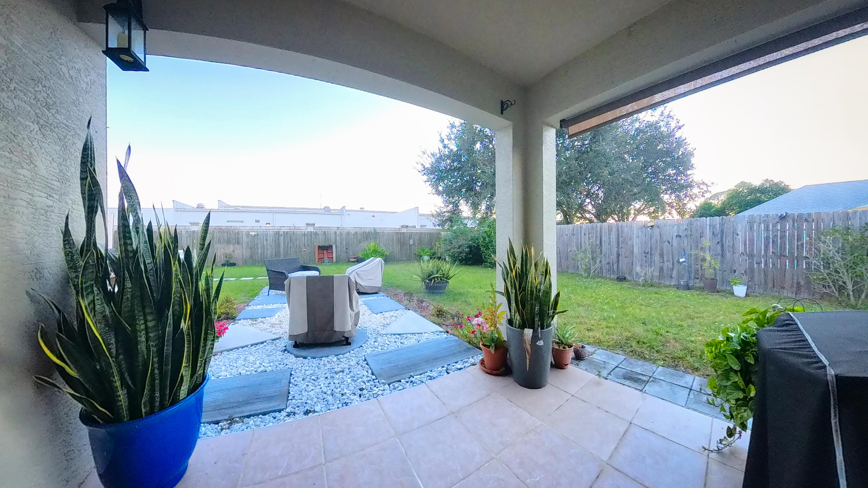 1162 Southwest Coleman Avenue Port St. Lucie, FL 34953 - Photo 23 of 27 a view of a garden with plants