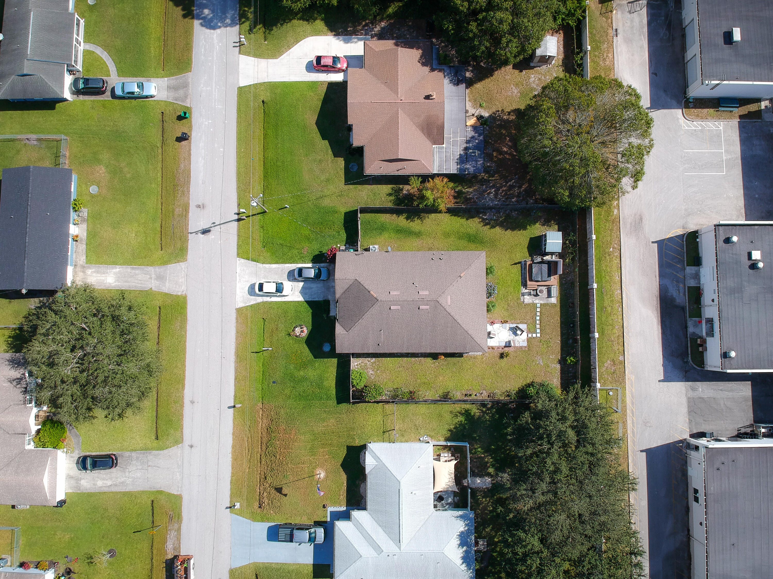 1162 Southwest Coleman Avenue Port St. Lucie, FL 34953 - Photo 4 of 27 an aerial view of residential houses with outdoor space and parking