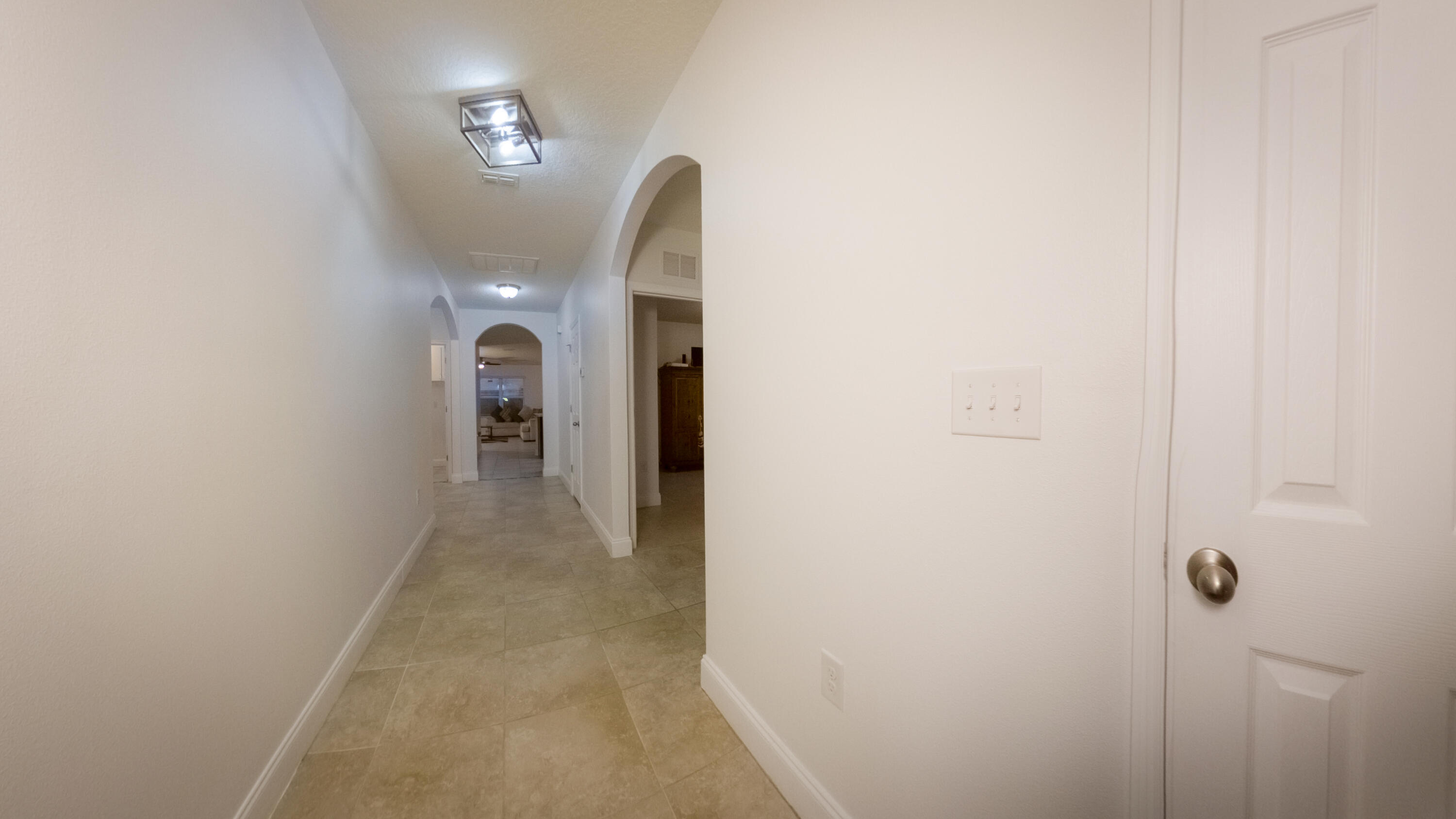 1162 Southwest Coleman Avenue Port St. Lucie, FL 34953 - Photo 5 of 27 a view of a hallway with entryway