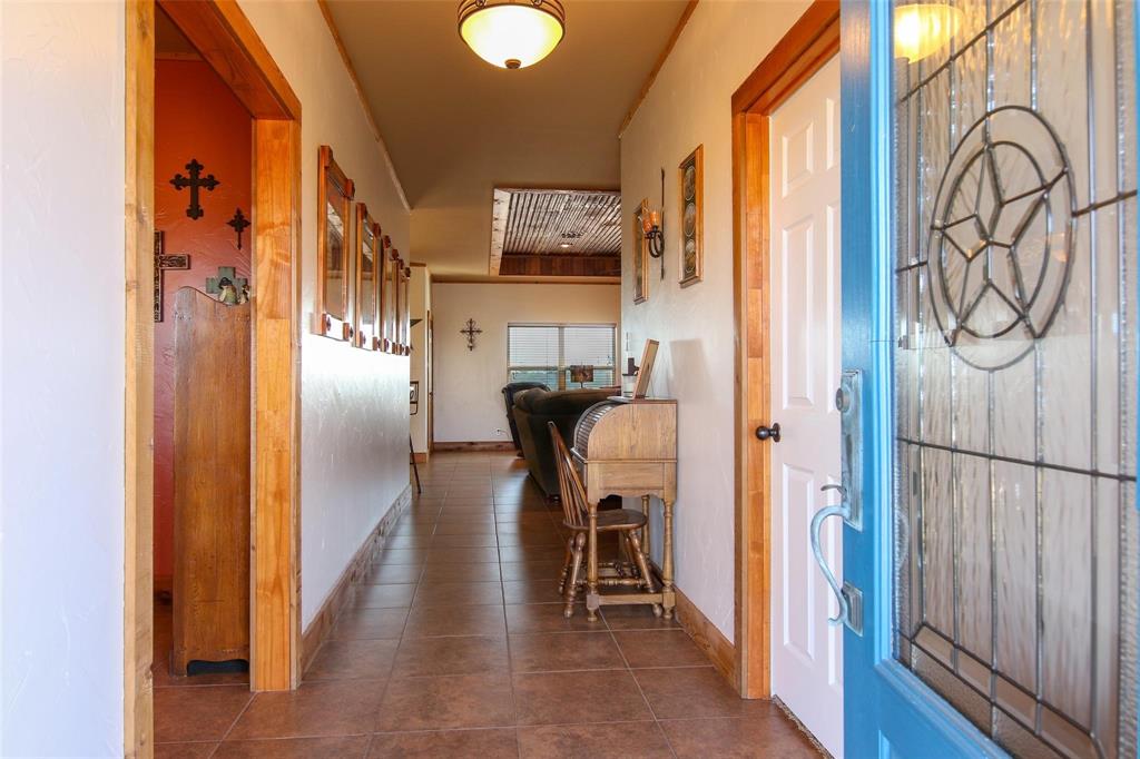7158 Luella Road Sherman, TX 75090 - Photo 24 of 40 a view of a hallway with wooden floor and staircase