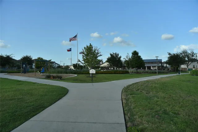 a view of a golf course with a lake