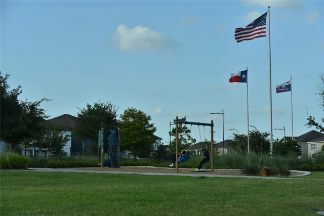 a front view of a house with plants