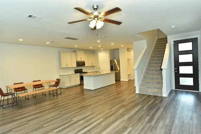 a view of kitchen and dining room with wooden floor