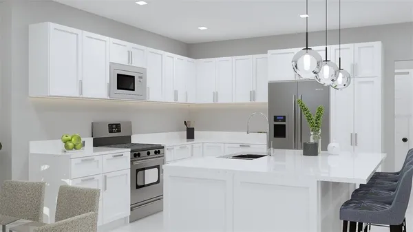 a kitchen with kitchen island white cabinets and white appliances