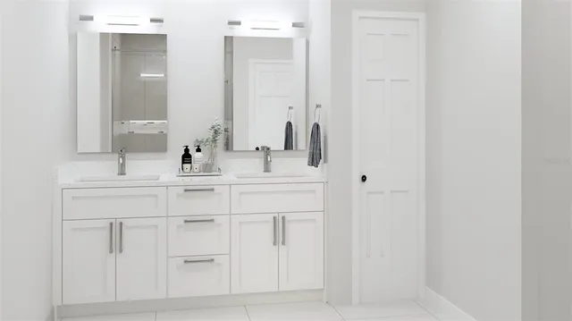 a bathroom with a sink vanity and a mirror