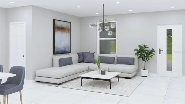 a living room with furniture and a chandelier