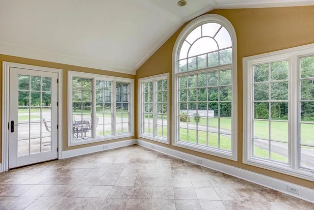 a view of an empty room with a large window
