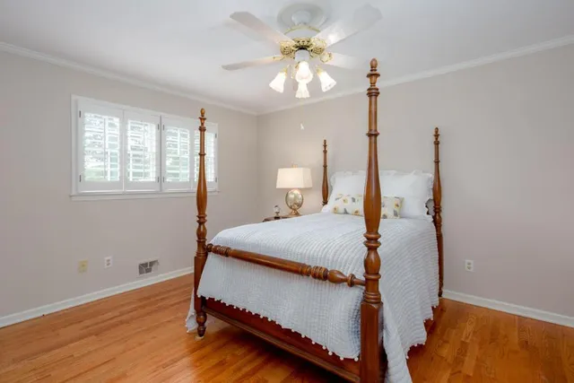 a bed room with a bed and a chandelier