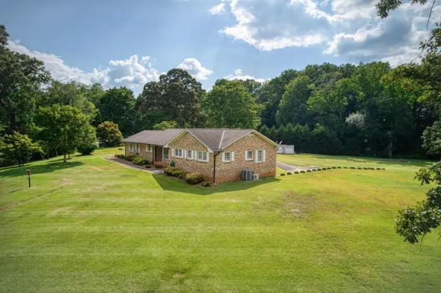 a view of a swimming pool with an outdoor space and seating area