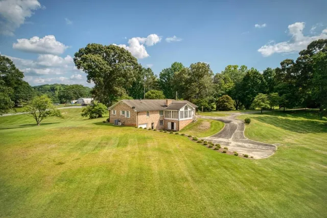 a view of a swimming pool with a yard