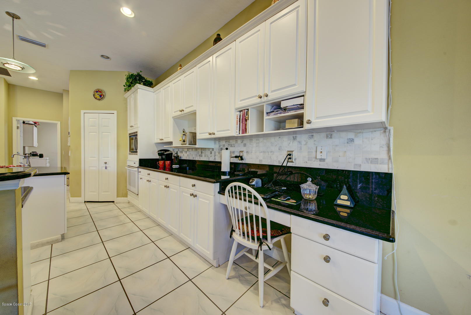 4055 Turtle Mound Road Melbourne, FL 32934 - Photo 11 of 80 Kitchen with Built-in Desk