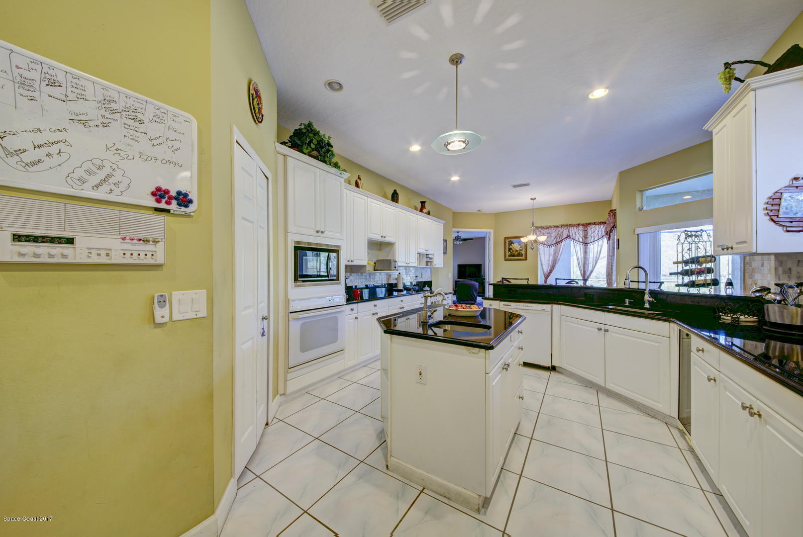 4055 Turtle Mound Road Melbourne, FL 32934 - Photo 14 of 80 Kitchen with Prep Sink in Island