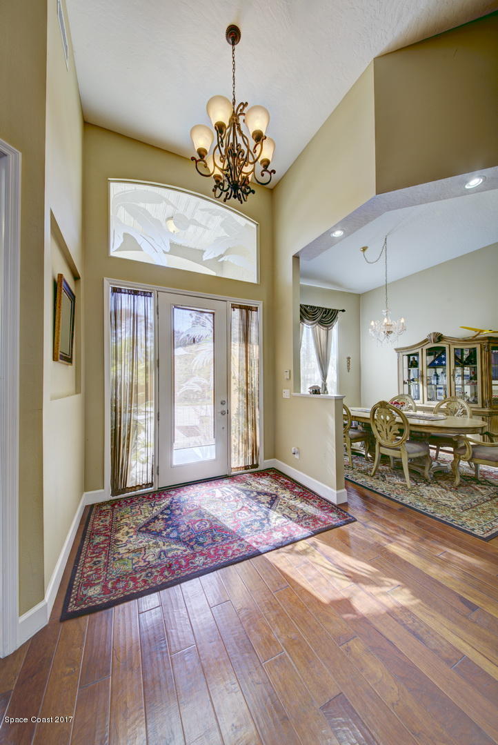4055 Turtle Mound Road Melbourne, FL 32934 - Photo 3 of 80 Foyer View & Formal Dining Room