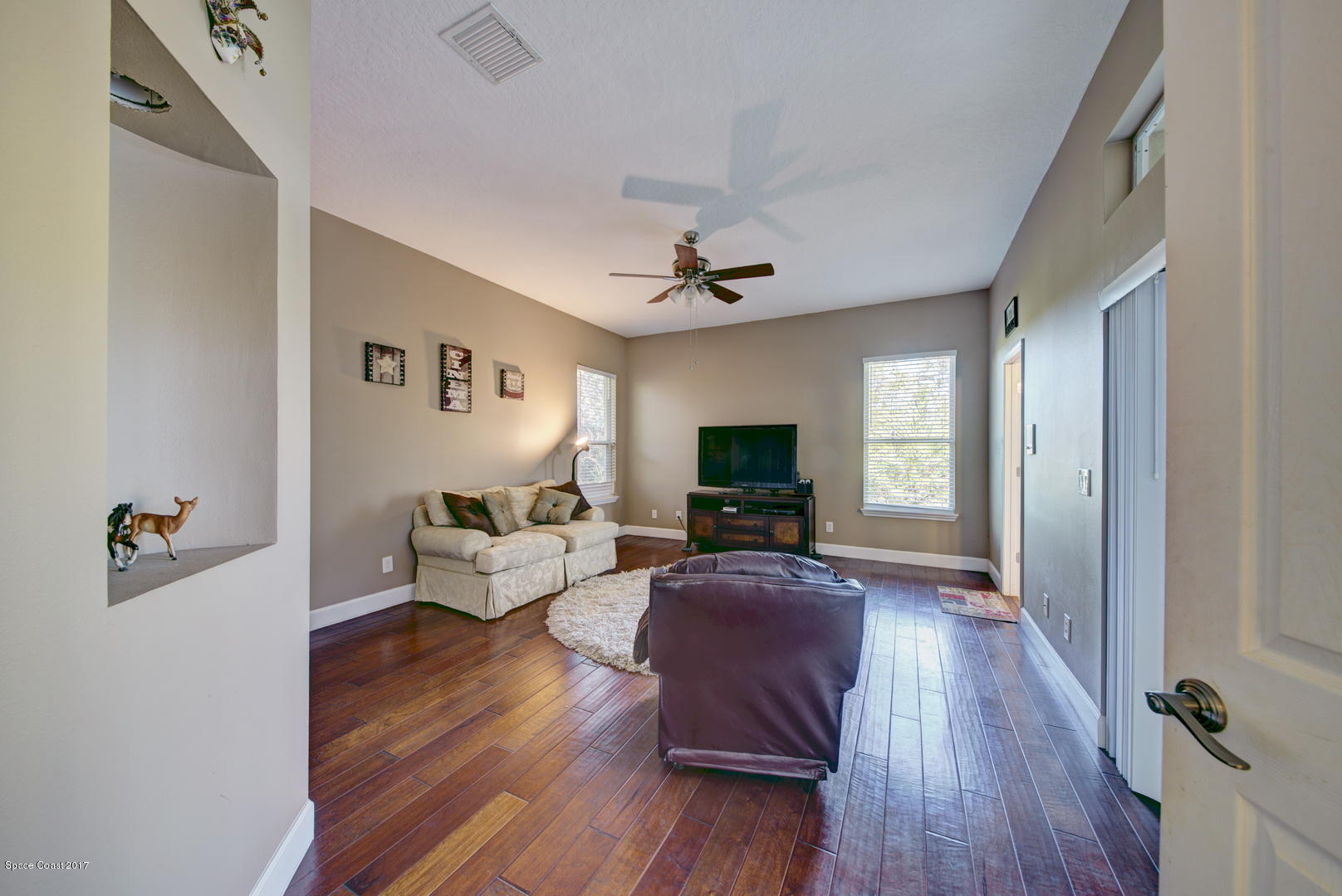 4055 Turtle Mound Road Melbourne, FL 32934 - Photo 21 of 80 Bedroom 3 /Family Room & Hardwood Floor