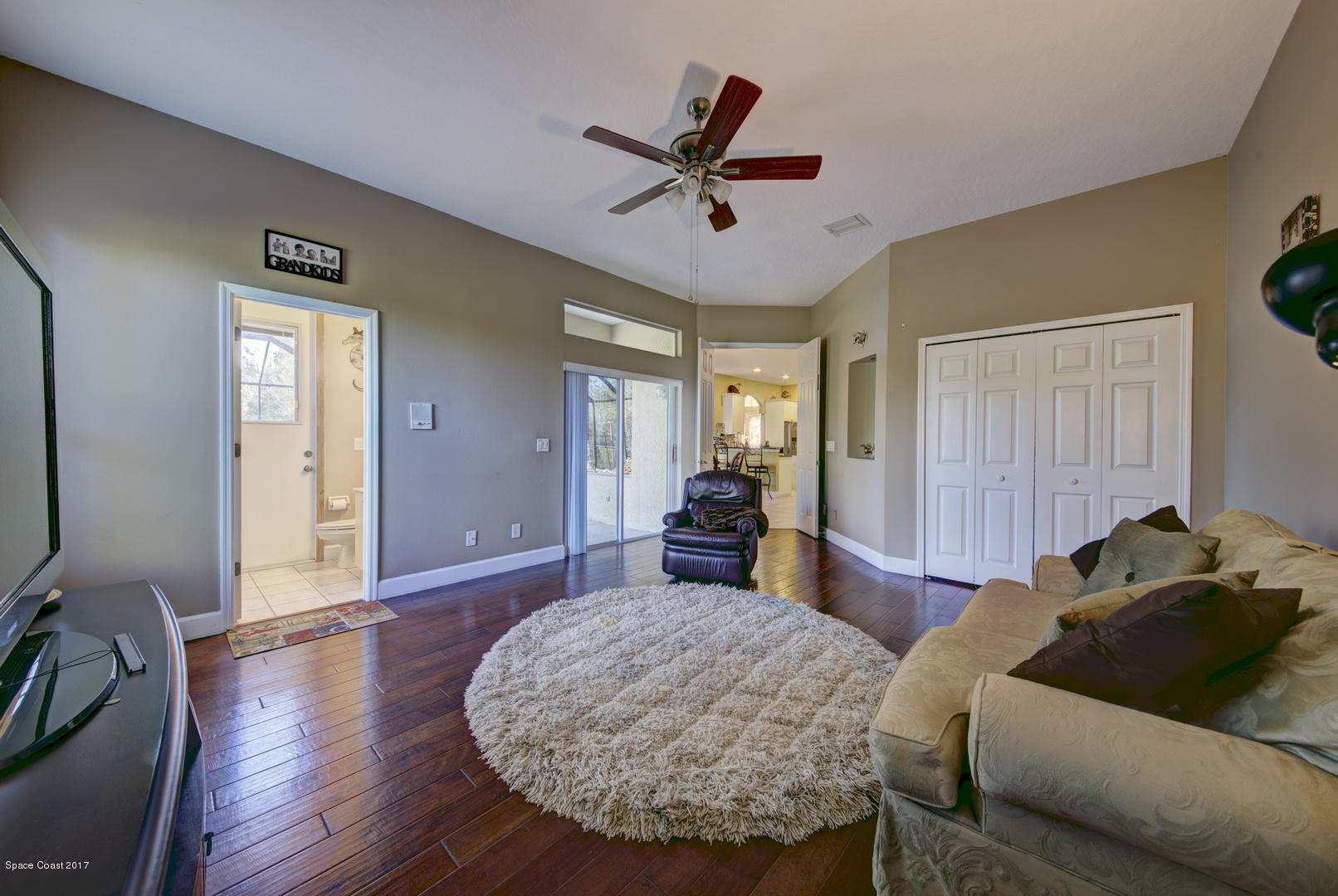 4055 Turtle Mound Road Melbourne, FL 32934 - Photo 22 of 80 Family Room w/ Bathroom 3 access to Pool