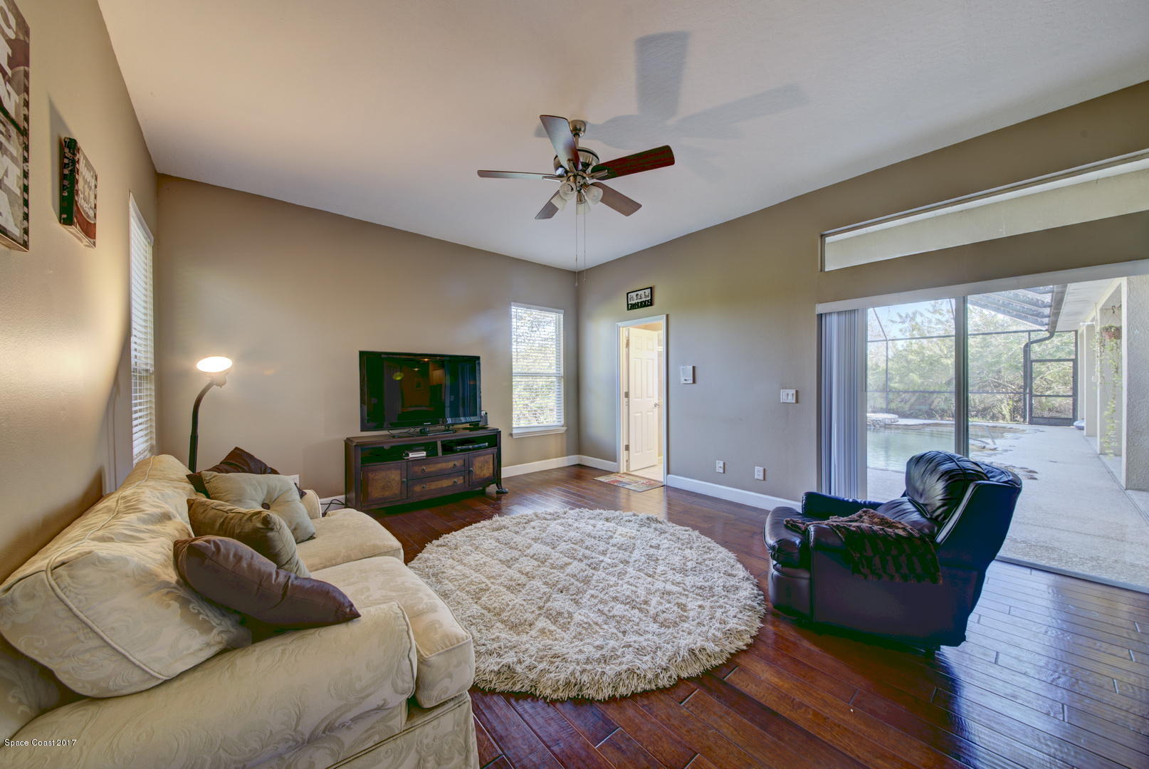 4055 Turtle Mound Road Melbourne, FL 32934 - Photo 23 of 80 Family Room access to Pool