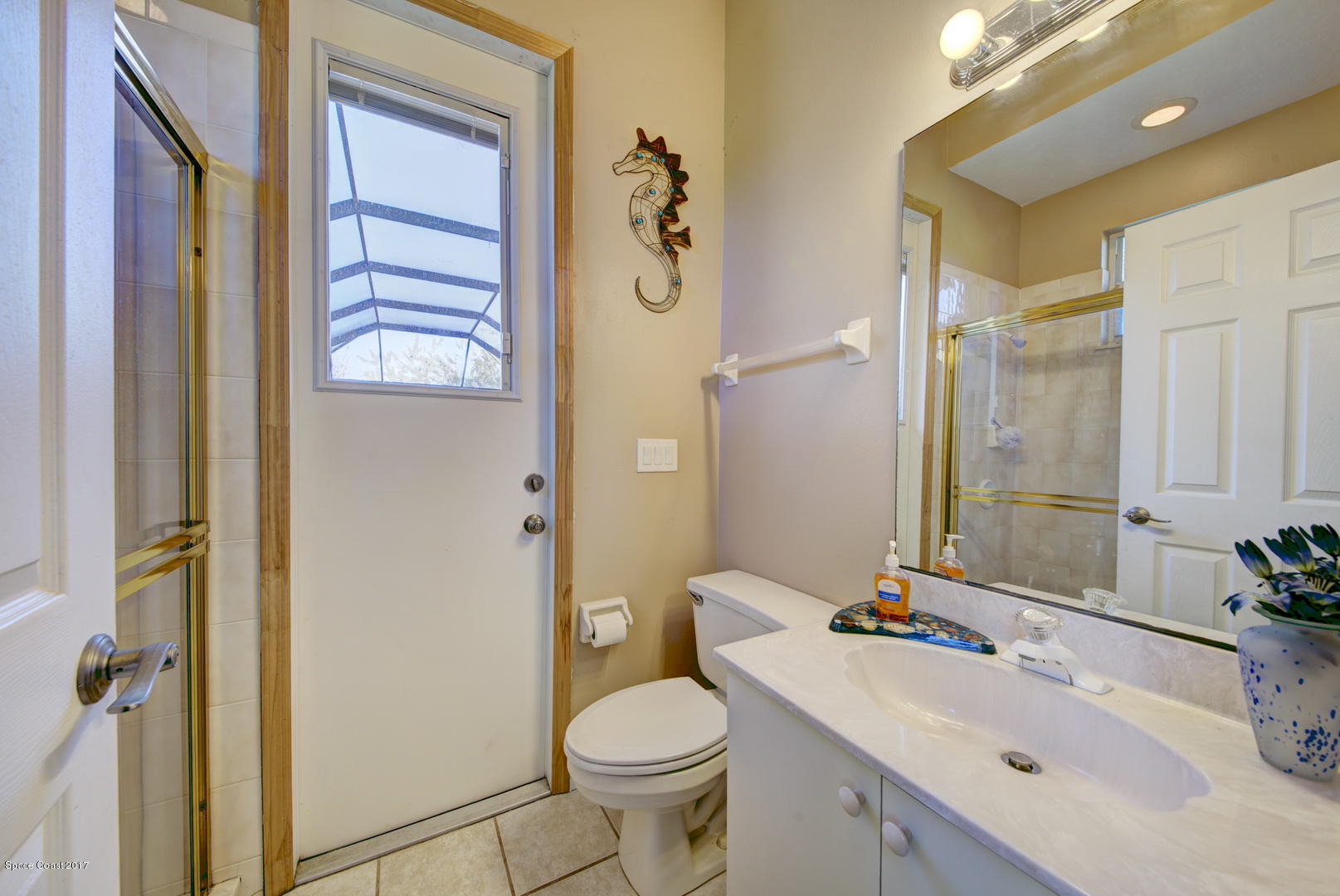 4055 Turtle Mound Road Melbourne, FL 32934 - Photo 25 of 80 Bathroom 3 access to Pool